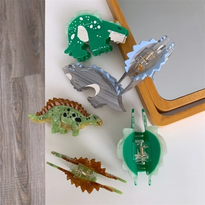 Minimalist cartoon dinosaur hair claw clips made of colorful acetate in various shapes