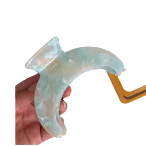 Iridescent light blue acetate hair claw clip with crescent moon texture for thick hair
