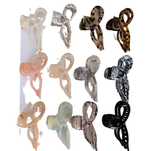 Set of 12 thick acetate bow hair claw clips in various tortoiseshell and marble patterns