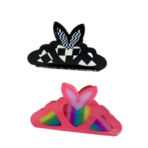 Checkered and rainbow heart claw clips with bunny ear accents for thick hair
