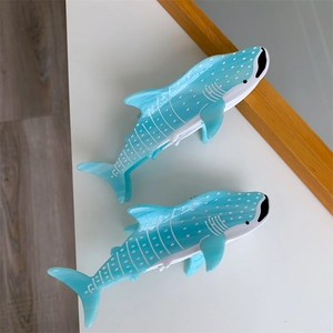 Detailed top view of two blue whale shark hair claws with white spotted acetate texture