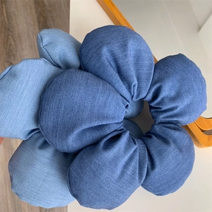 Oversized denim fabric flower scrunchie in blue patchwork design for women