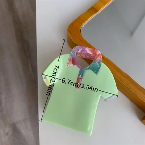 Detail showing height and width measurements of a green shirt-shaped acetate hair claw clip