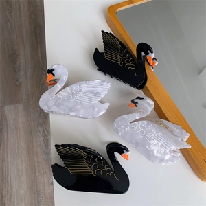Elegant swan-shaped hair claw clips in black and white marble acetate for women