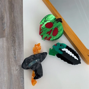 Lot de trois pinces à cheveux Halloween en acétate avec motifs de monstres et de pomme