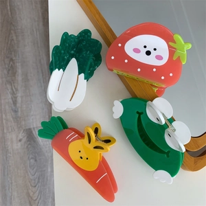 Detailed set of cute cartoon acetate hair claws with frog, strawberry and rabbit designs