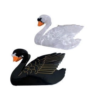 Elegant swan shaped acetate hair claws in black and white pearlescent marble finish
