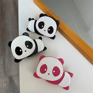 Close-up of cute panda hair claws in black, white and pink acetate finishes