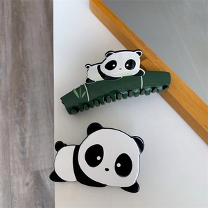 Detail shot of cute panda and bamboo hair claws made from glossy acetate material
