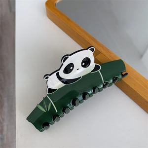 Detail of panda and green bamboo acetate hair claw clip with glossy finish