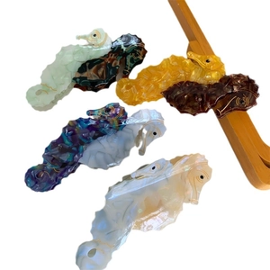 Seahorse acetate hair claws set in various colors including amber and marble patterns