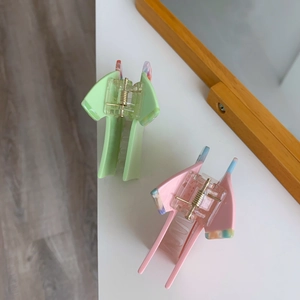 Creative clothes and shoes shaped acetate hair claws in pastel mint and pink colors