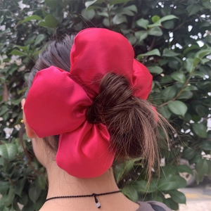 Oversized red satin flower scrunchie hair tie for women stylish ponytail accessory