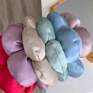 Macro shot of colorful satin hair scrunchies with smooth texture and thick design