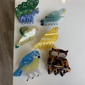Unique colorful bird-shaped acetate hair claws set featuring six creative animal designs