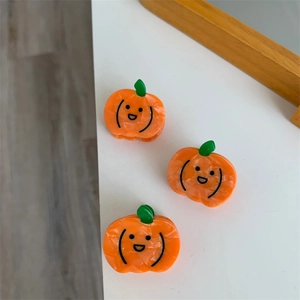 Tres mini pinzas para el cabello de calabaza naranja en acetato con hojas y caras felices