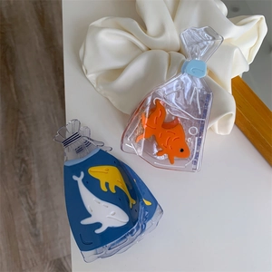 Detailed view of creative goldfish and whale acetate hair claws with a glossy finish