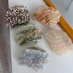 Detailed set of acetate shell hair claws in diverse tortoiseshell and pearlescent finishes