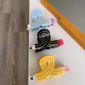 Creative pencil shaped hair claws in blue, black, and yellow acetate material