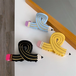 Creative pencil-shaped acetate hair claws in blue yellow and black for half-up hairstyles
