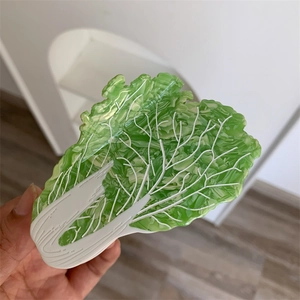 Detailed macro view of creative Chinese cabbage hair claw clip with green acetate gradient