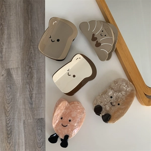 Set di 5 mollette per capelli a cartone animato con design di toast e croissant