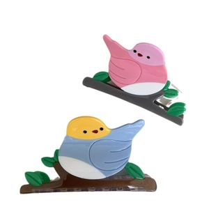 Pinces à cheveux en acétate oiseau sur branche en combinaisons de rose et bleu
