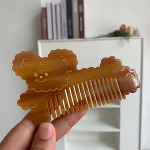 Cute cartoon dog-shaped thick acetate hair comb with amber translucent finish and gold details