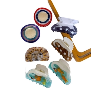 Artistic acetate hair claws with creative swan and celestial designs for women