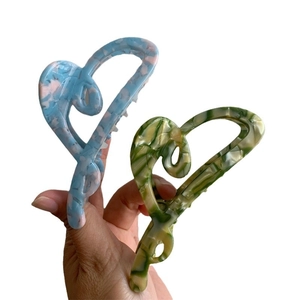 Large heart shaped acetate hair claw clips with marble texture for thick hair styling