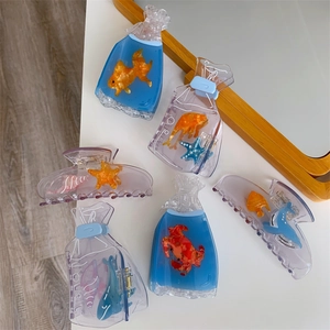 Set of 6 ocean-themed resin hair claws featuring starfish, dolphin, and crab shapes