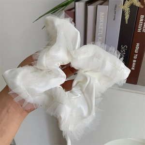 Elegant large cream silk scrunchie with delicate lace trim edging and pleats