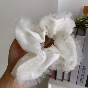 Elegant white satin scrunchie with delicate lace edges for a French sweet style aesthetic