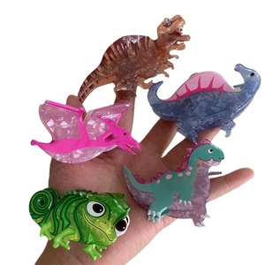 Colorful dinosaur acrylic hair claws with marble texture set on white background