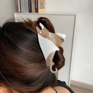 Artistic manta ray hair claw clip in cream and amber acetate for women's updos