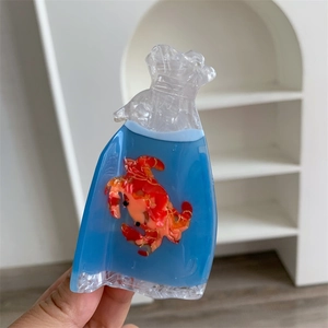 Detailed close-up of a creative goldfish water bag hair claw clip made of acetate material