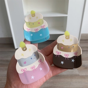 Detailed view of three cake-shaped hair claws with bows and star patterns