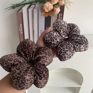 Velvet leopard print hair scrunchies in brown and grey colors for stylish women
