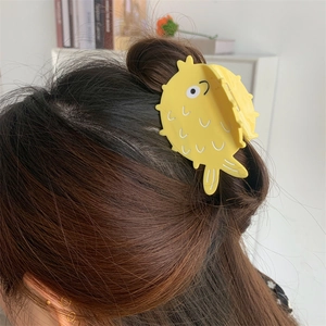 Cute yellow pufferfish hair claw clip made of acetate for creative hairstyling