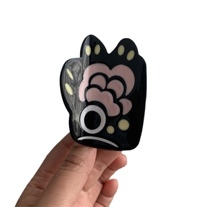 Creative bear paw hair claw clip with colorful abstract patterns on black acrylic base