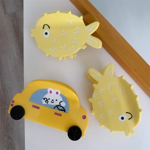Cute yellow acetate hair claw clips set featuring pufferfish and rabbit car designs