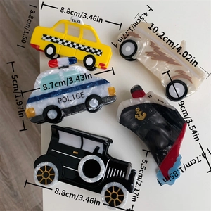 Detailed size comparison of acetate hair claws in taxi and police car shapes
