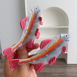 Pink and blue fish-shaped acetate hair claw clips for women with a pearlescent finish