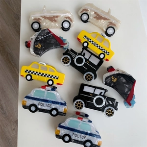 Acetate hair claw clips in various vehicle shapes including taxi and police car