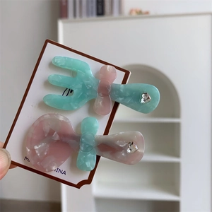 Set di fermagli per capelli in acetato a forma di posate con strass a cuore e fiocco