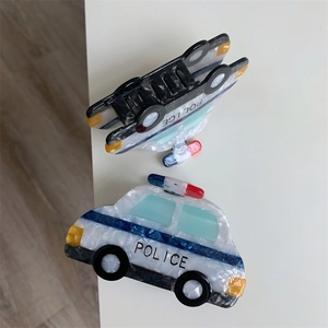 Set of two police car shaped hair claws made of marble textured acetate material