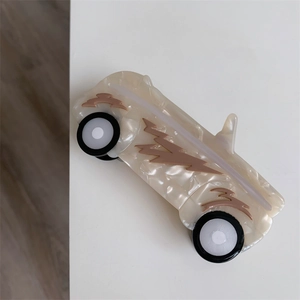 Detailed view of taxi car shaped acetate hair claw clip with unique marble patterns