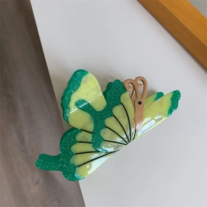 3D butterfly hair claw clip with yellow and green marble texture and fine glitter