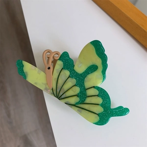 3D butterfly hair claw clip with green glitter and beige resin finish for women