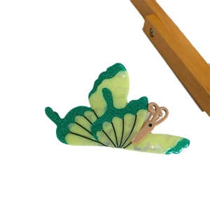 3D butterfly hair claw clip in yellow and green glitter acetate for half-up hairstyles